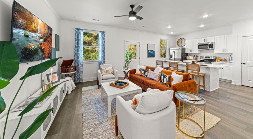 a living room with a large painting